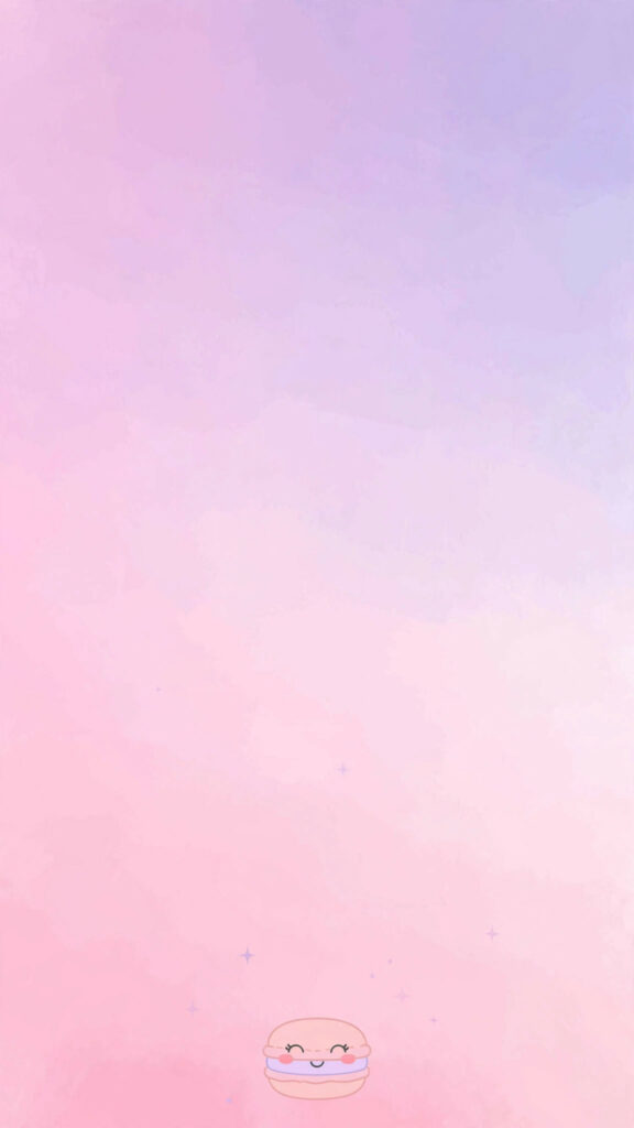 Kawaii macaron wallpaper: tiny macaron at the bottom with a vast empty pink-to-lavender gradient